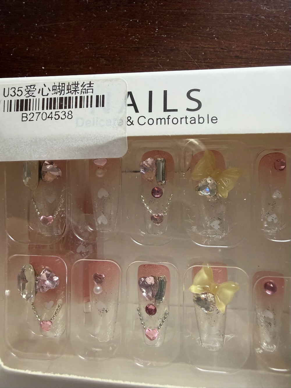 Decorative Press-On Nails with Pink Gems and Yellow Bow